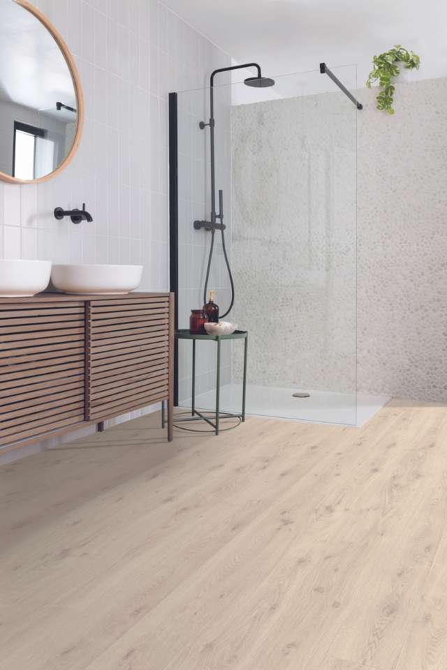 white oak look laminate in modern bathroom with shower and greenery